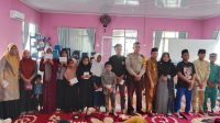 Bhabinkamtibmas Polsek Tualang Hadir dan Berikan Santunan ke Anak Yatim yang Diselenggarakan Oleh Pemerintah Kampung Maredan Barat.